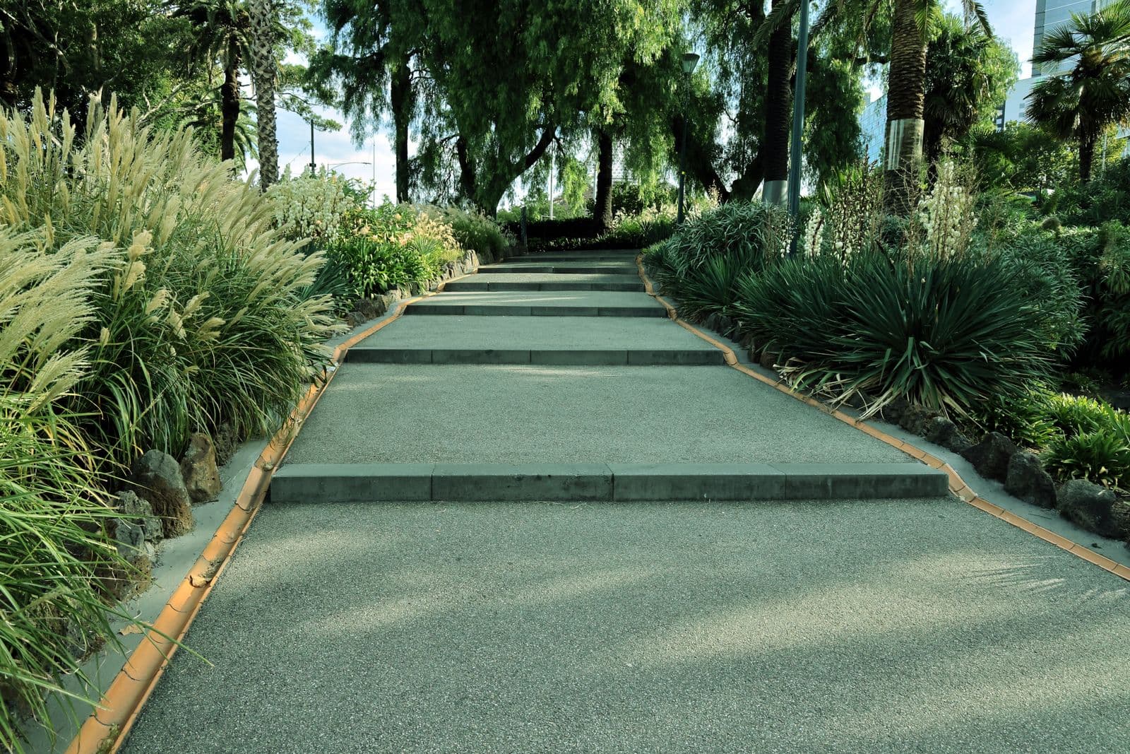 Broad steps flanked by ornamental grasses