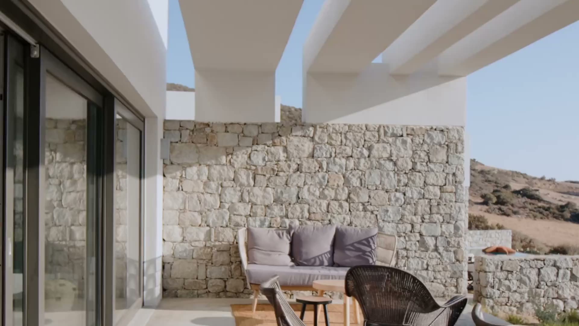 Mosaic flagstone walls framing a stone terrace