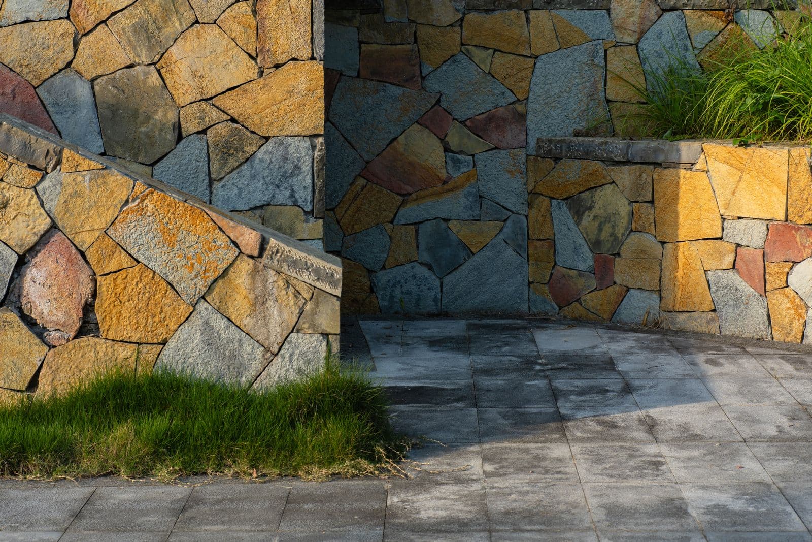 Mosaic flagstone walls framing a stone terrace